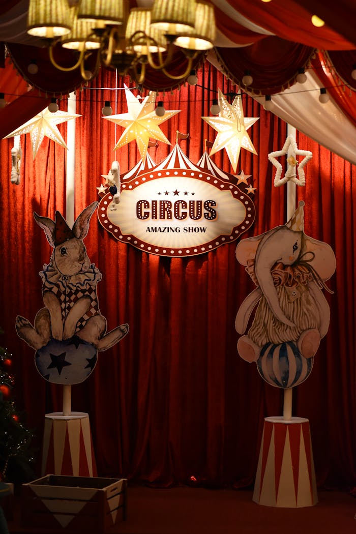 Captivating circus setup with playful animals and star decorations under warm lights.